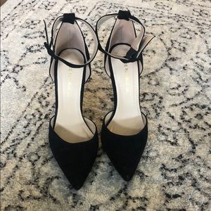 Black suede pointed toe heels